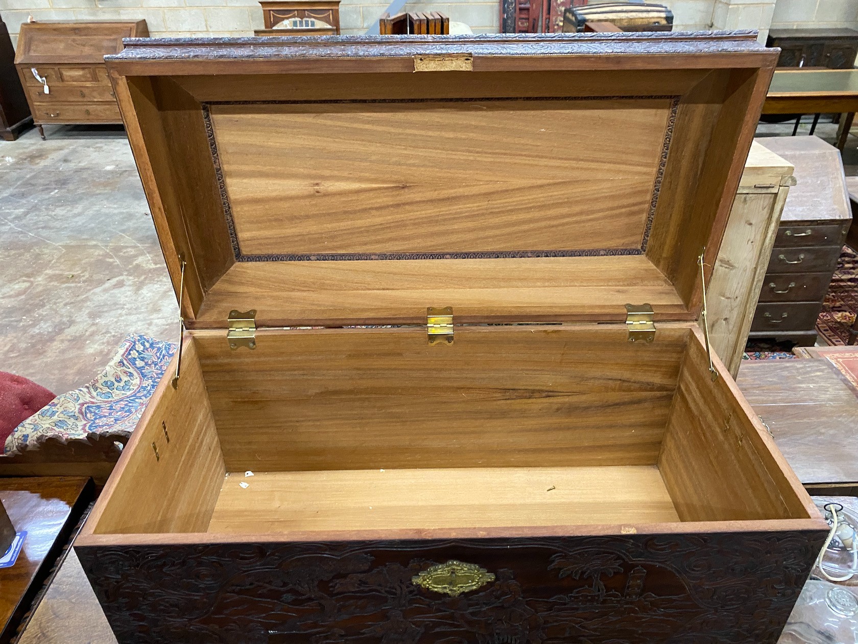 A carved teak coffer, length 101cm, depth 52cm, height 58cm